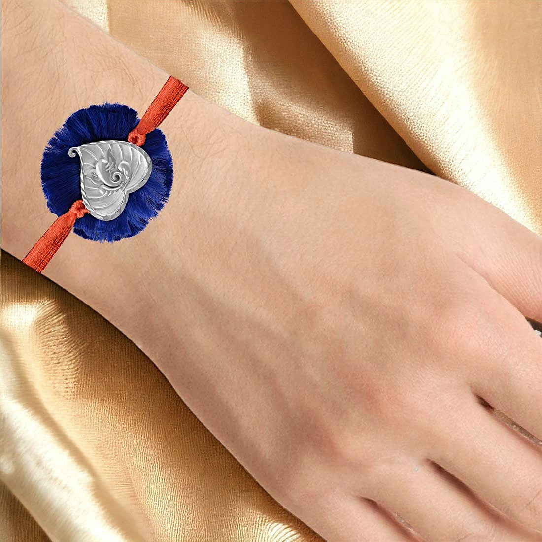 Ganesh In Heart Rakhi In Blue