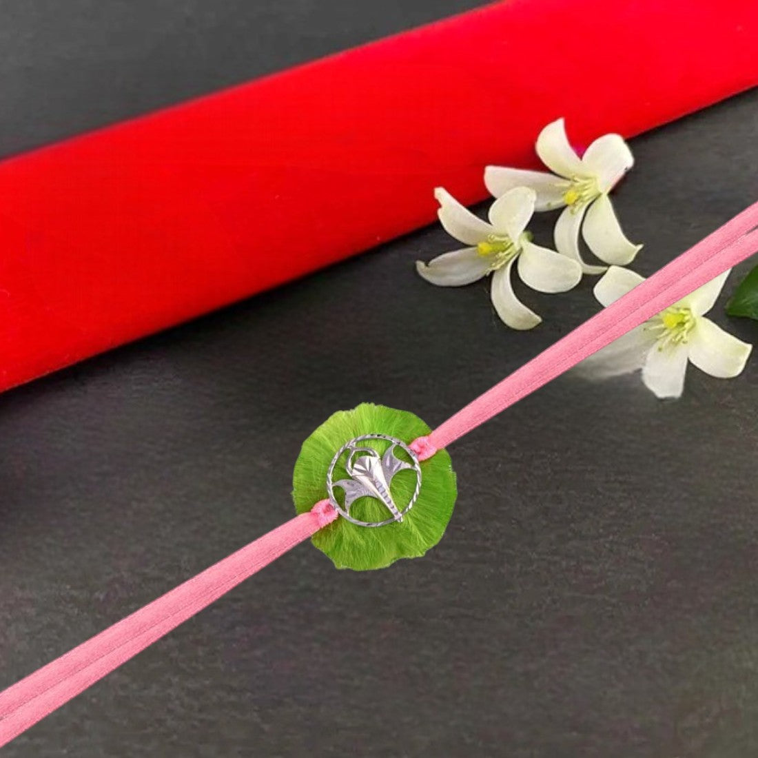 Ganesh Trunk Rakhi In Green
